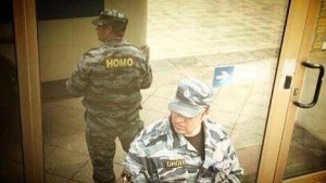 Russian OMOH policeman reflected showing HOMO
